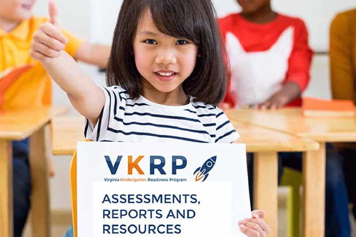 girl showing a thumbs up sign holding poster of VKRP assessments, reports, and resources