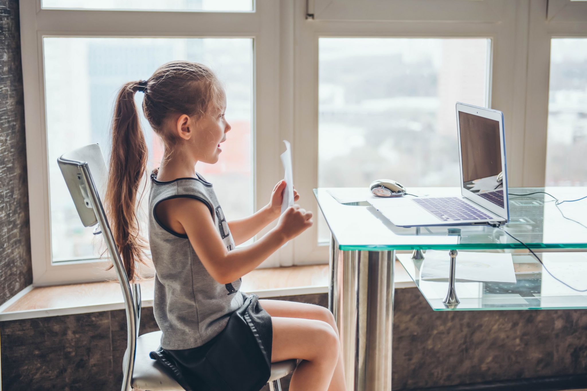 Young girl learning virtually at the computer